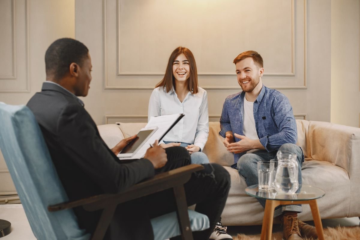 A SCOOBYLIFE agent meeting with a client couple
