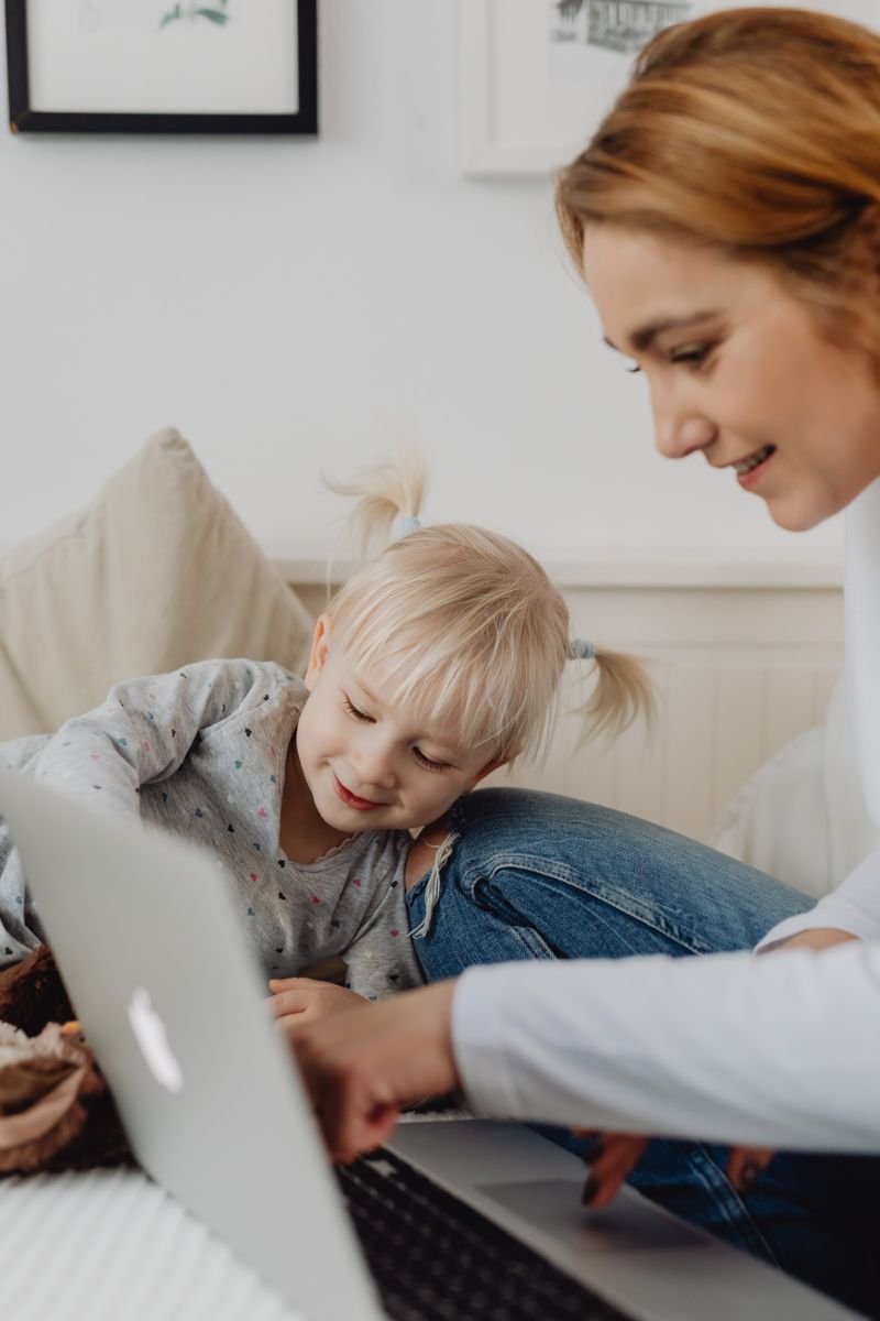 A parent and child exploring coverage options together online